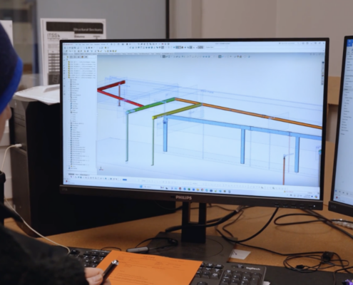 man on computer using AI